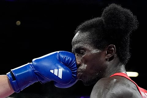 Thitisan Panmot fights David De Pina during Men's 51kg boxing match